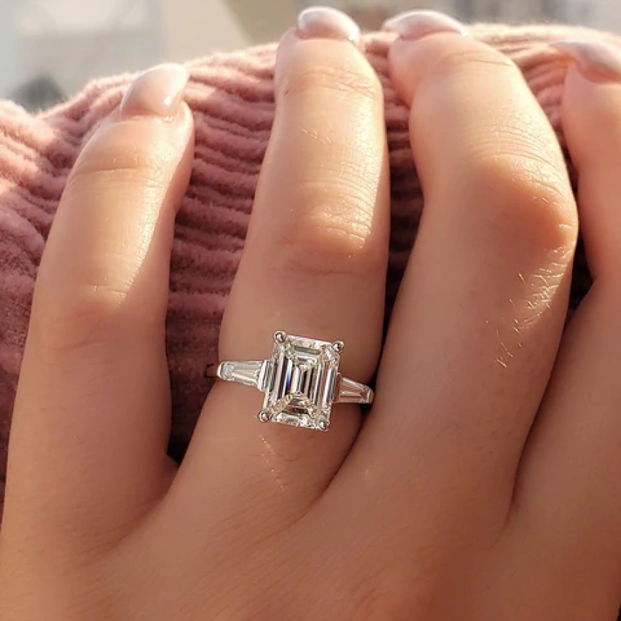 Emerald cut engagement rings with dramatic flair